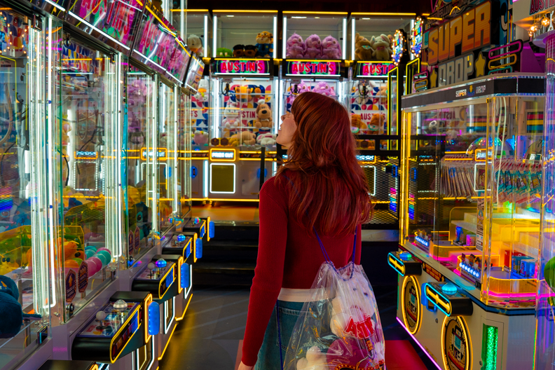girl walking through claw lounge